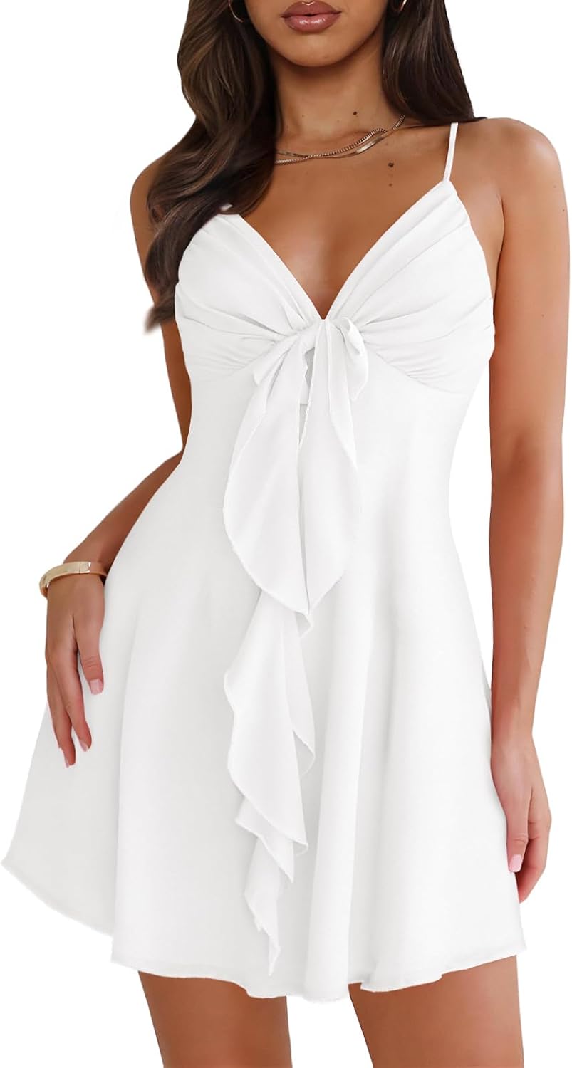 Mesh mini dress with spaghetti straps, backless back, and bow detail