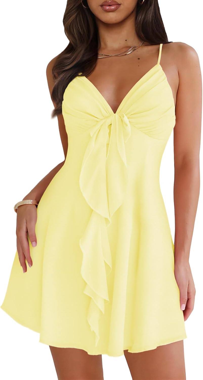 Mesh mini dress with spaghetti straps, backless back, and bow detail