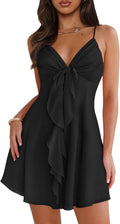 Mesh mini dress with spaghetti straps, backless back, and bow detail