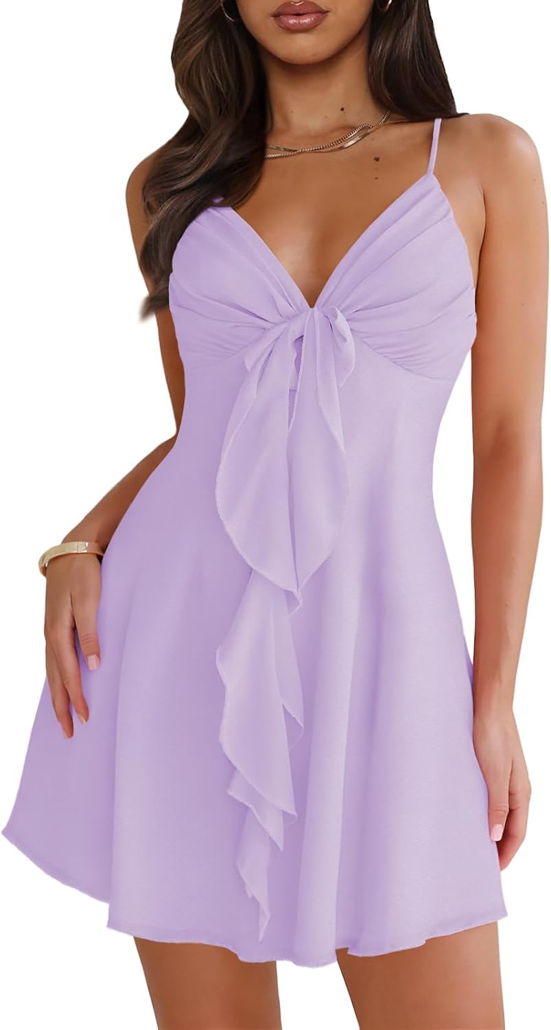 Mesh mini dress with spaghetti straps, backless back, and bow detail