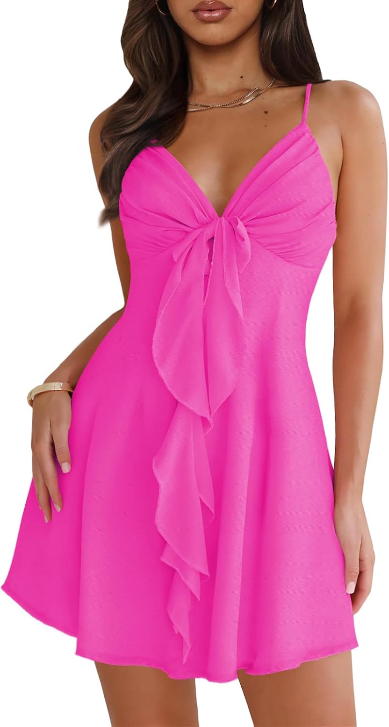 Mesh mini dress with spaghetti straps, backless back, and bow detail